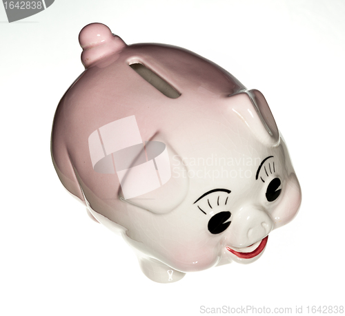 Image of Pink pottery piggy bank isolated