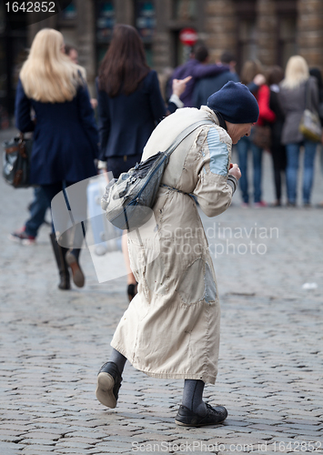 Image of Poor old woman begging in Brussels