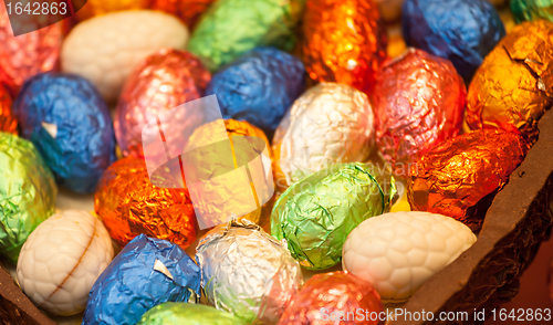 Image of Foil wrapped easter eggs in chocolate egg