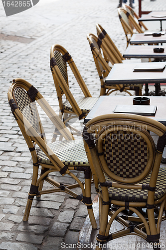 Image of Empty cafe tables in Brussels cobbled square