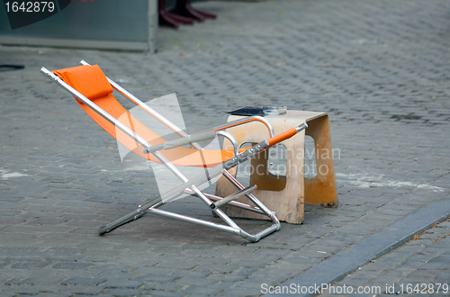 Image of Orange chair with table in roadside cafe