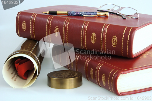Image of Books and graduation diploma