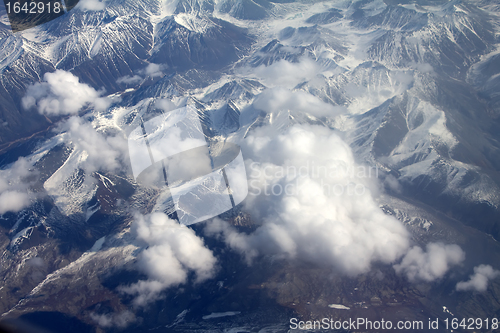 Image of  Pattern of snow, clouds and stones: view from height.