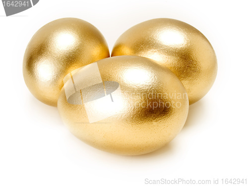 Image of Golden eggs isolated on white background.