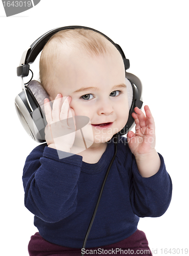 Image of young child with ear-phones listening to music