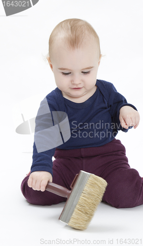 Image of young child with brush