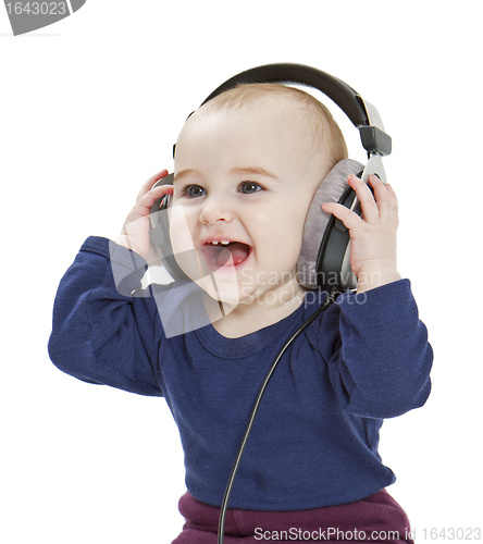 Image of young child with ear-phones listening to music