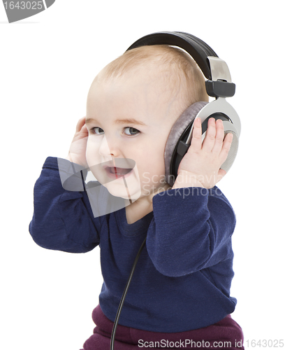 Image of young child with ear-phones listening to music