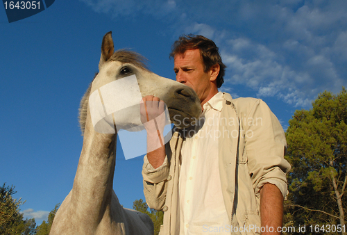 Image of man and little horse