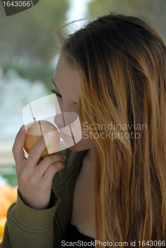Image of young girl and red apple