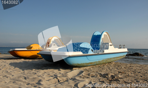 Image of two pedalos on a beach