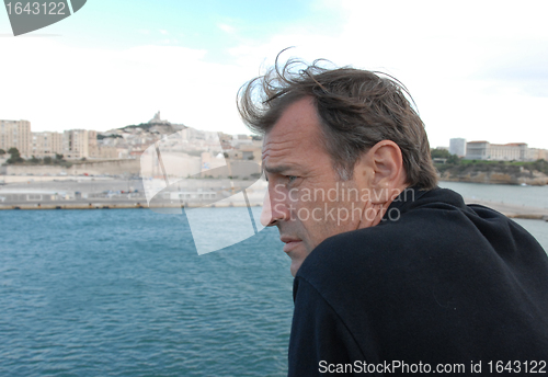 Image of man watching the sea