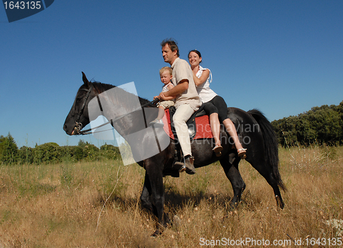 Image of family on horse