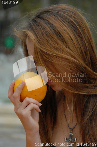 Image of teenager and orange