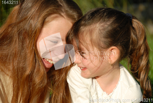 Image of teenager and little girl