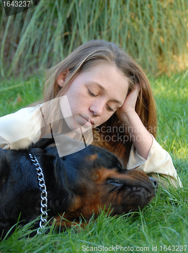 Image of sleeping dog and woman