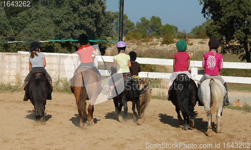 Image of children and ponies