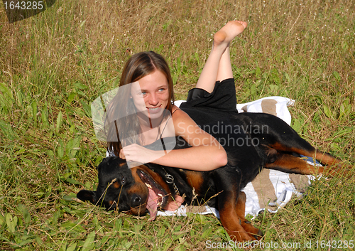 Image of girl and rottweiler