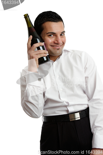 Image of Happy man with wine bottle
