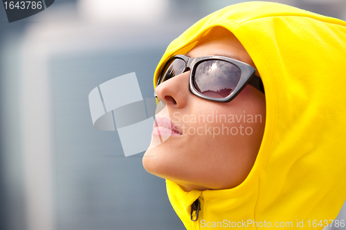 Image of girl in a yellow hood