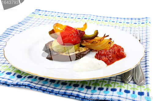 Image of Roasted vegetables with yogurt and tomato sauces.