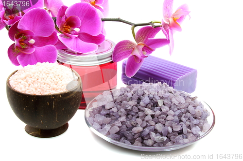 Image of  Fresh orchid, natural scrubbing soap and salt for bath. 