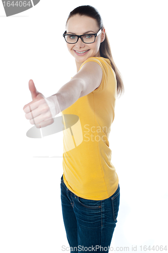 Image of Glamourous teenager gesturing thumbs-up
