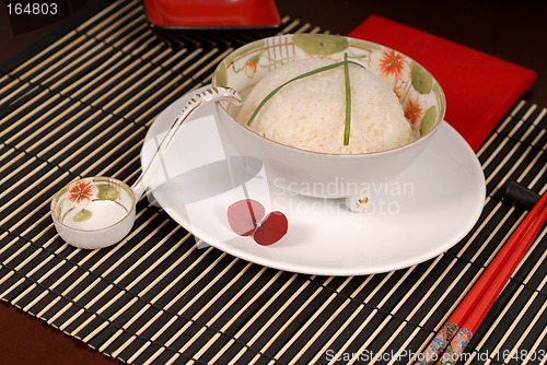 Image of Bowl of rice with chives in antique Asian bowl
