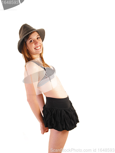 Image of Girl in skirt and bra.