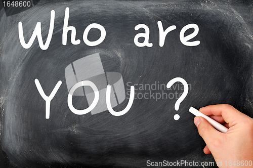 Image of Who are you question written on a blackboard