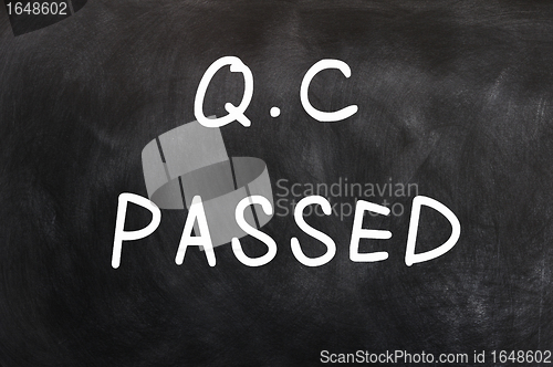 Image of QC passed written on a chalkboard 