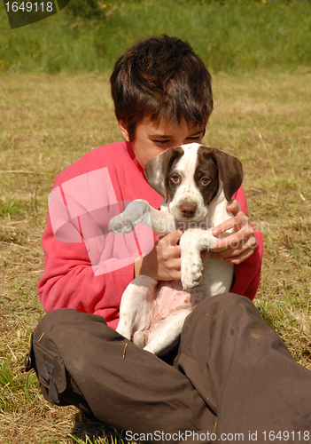 Image of child and puppy