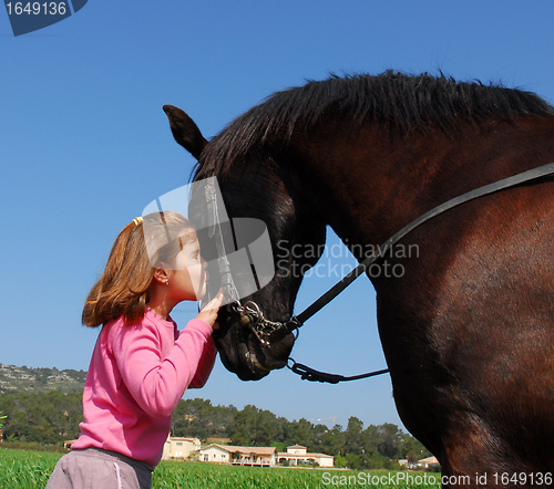 Image of child and black stallion