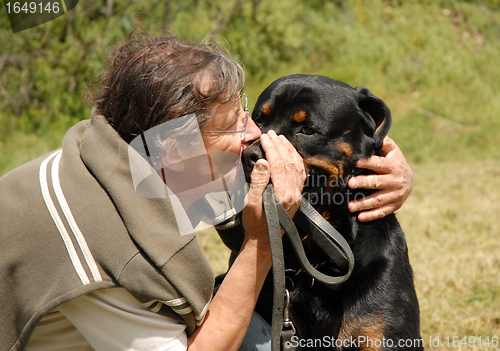 Image of man and rottweiler