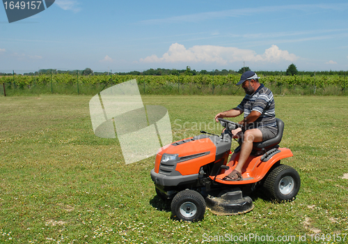 Image of man and lauwn mower