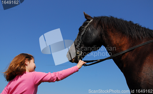 Image of child and black stallion