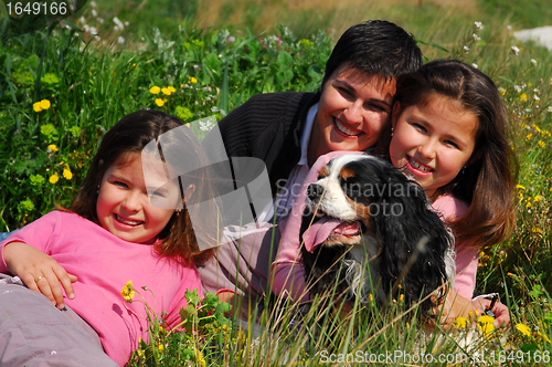 Image of family and dog