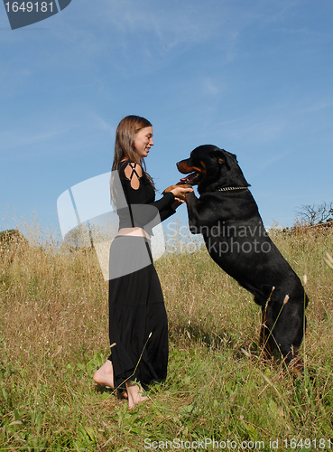 Image of girl and rottweiler