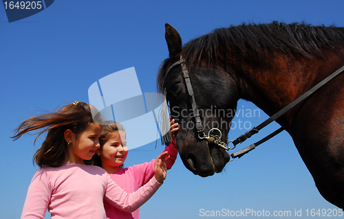 Image of twins and horse