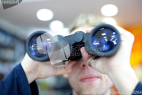 Image of man with binoculars