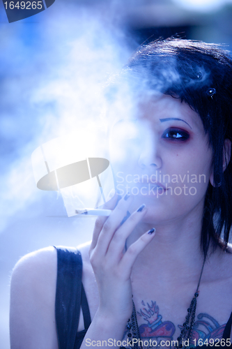 Image of smoking girl in gothic style