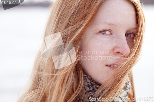 Image of redhead woman and wind