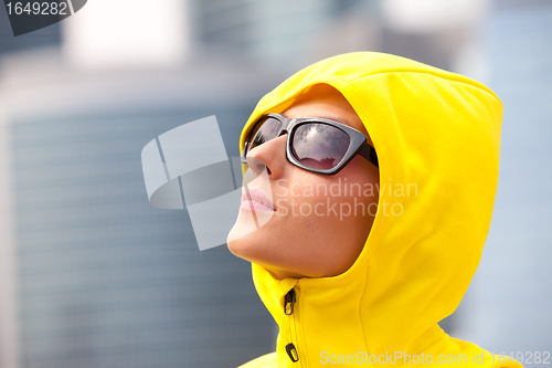 Image of girl in a yellow hood