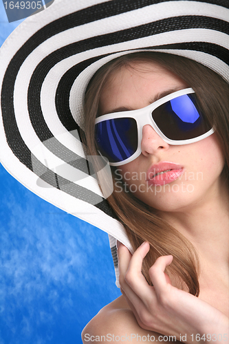 Image of young woman in striped hat