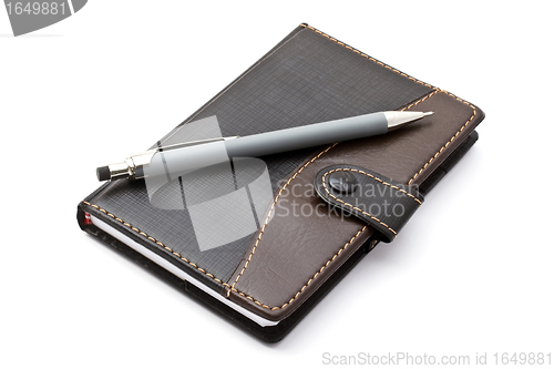 Image of Black notebook and Mechanical pencil 