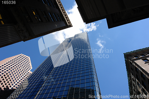 Image of Looking up at the top of five skyscrapers