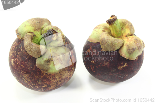 Image of two fresh Mangosteen