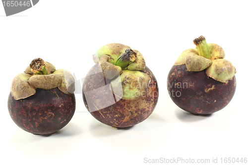 Image of three fresh Mangosteen