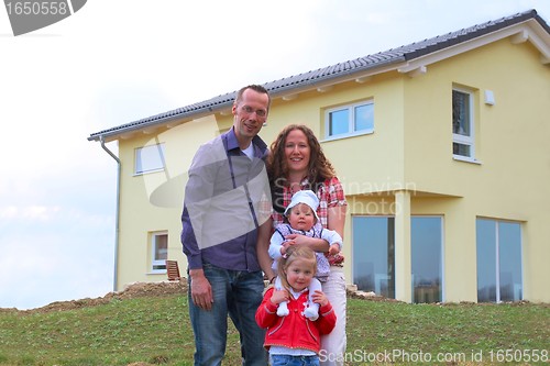 Image of Family in front of her house