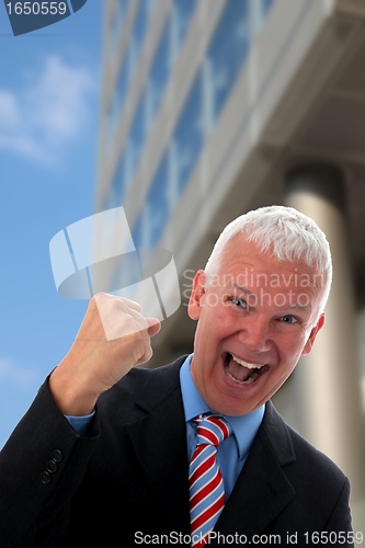 Image of Businessman crazy in front of a Skyscraper